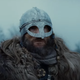 Svend, viking captain, sucks it up and wears his helmet.